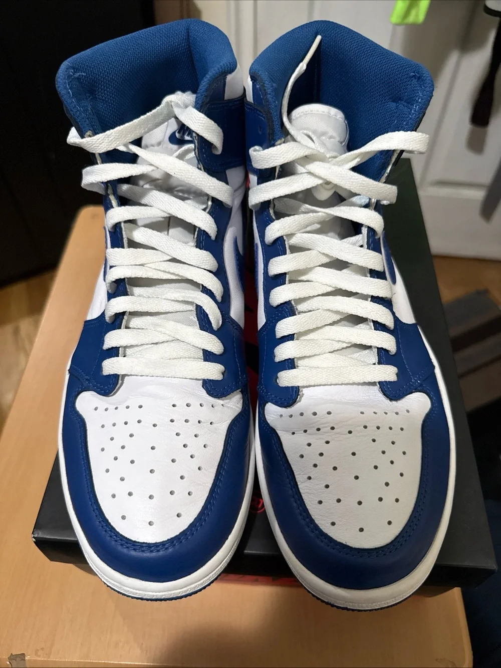 Jordan Air Jordan 1 Mid White and Blue Sneakers